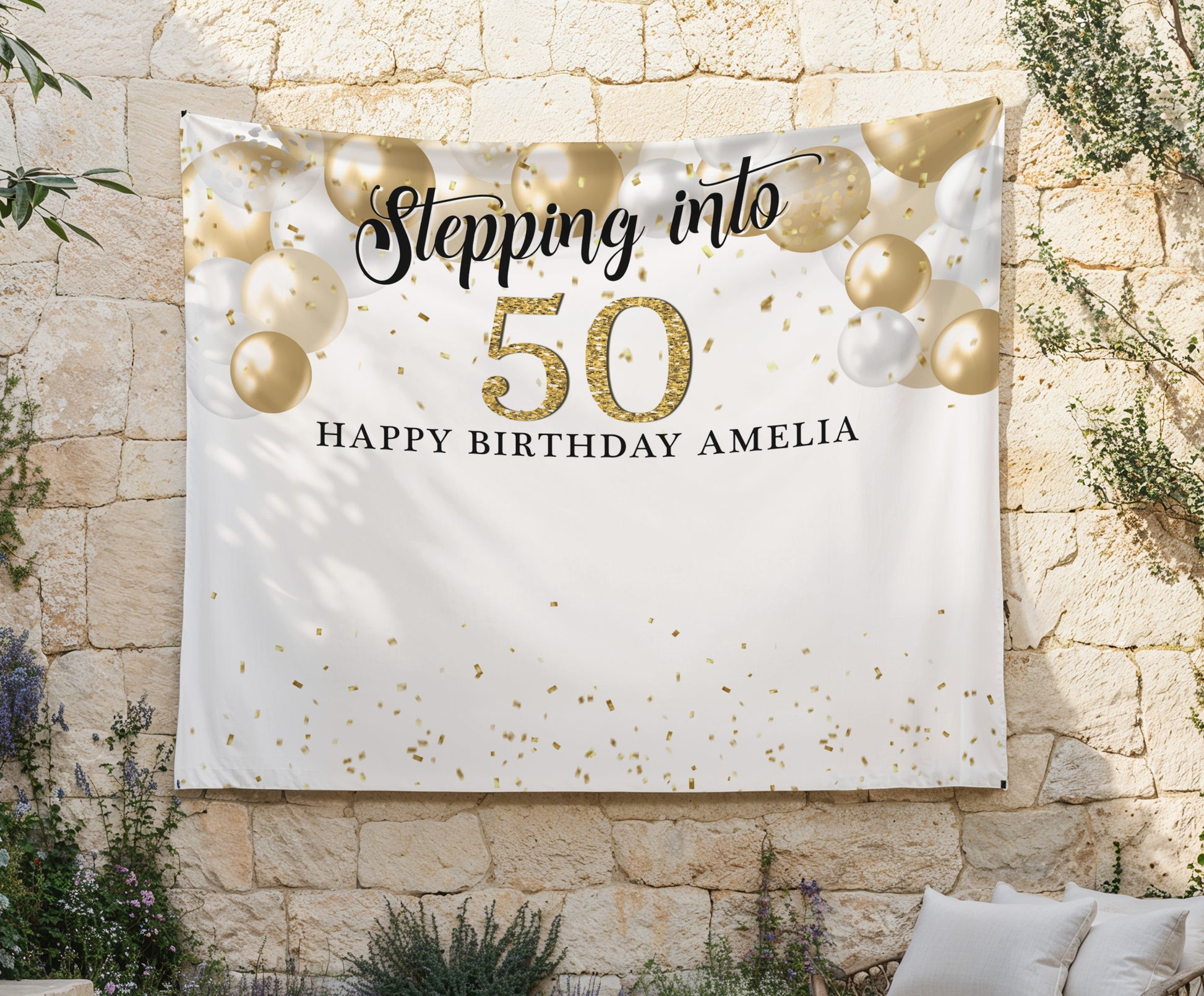 Birthday banner with gold balloons and text against a stone wall. Printed and Free Standard Shipped