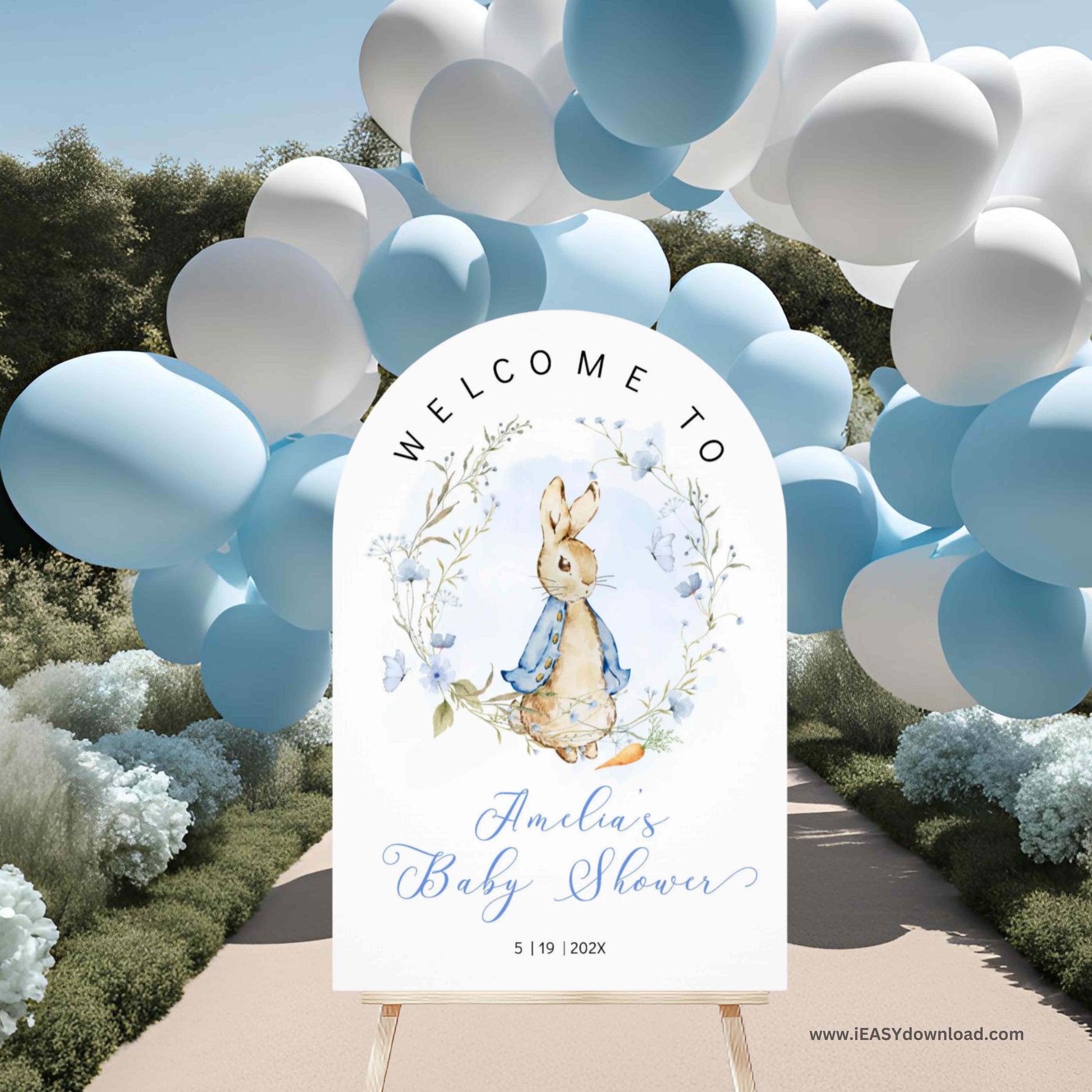 Baby shower welcome sign with Peter Rabbit design, surrounded by blue and white balloons and flowers. Printed and Free Shipping. Arch Foam Board.