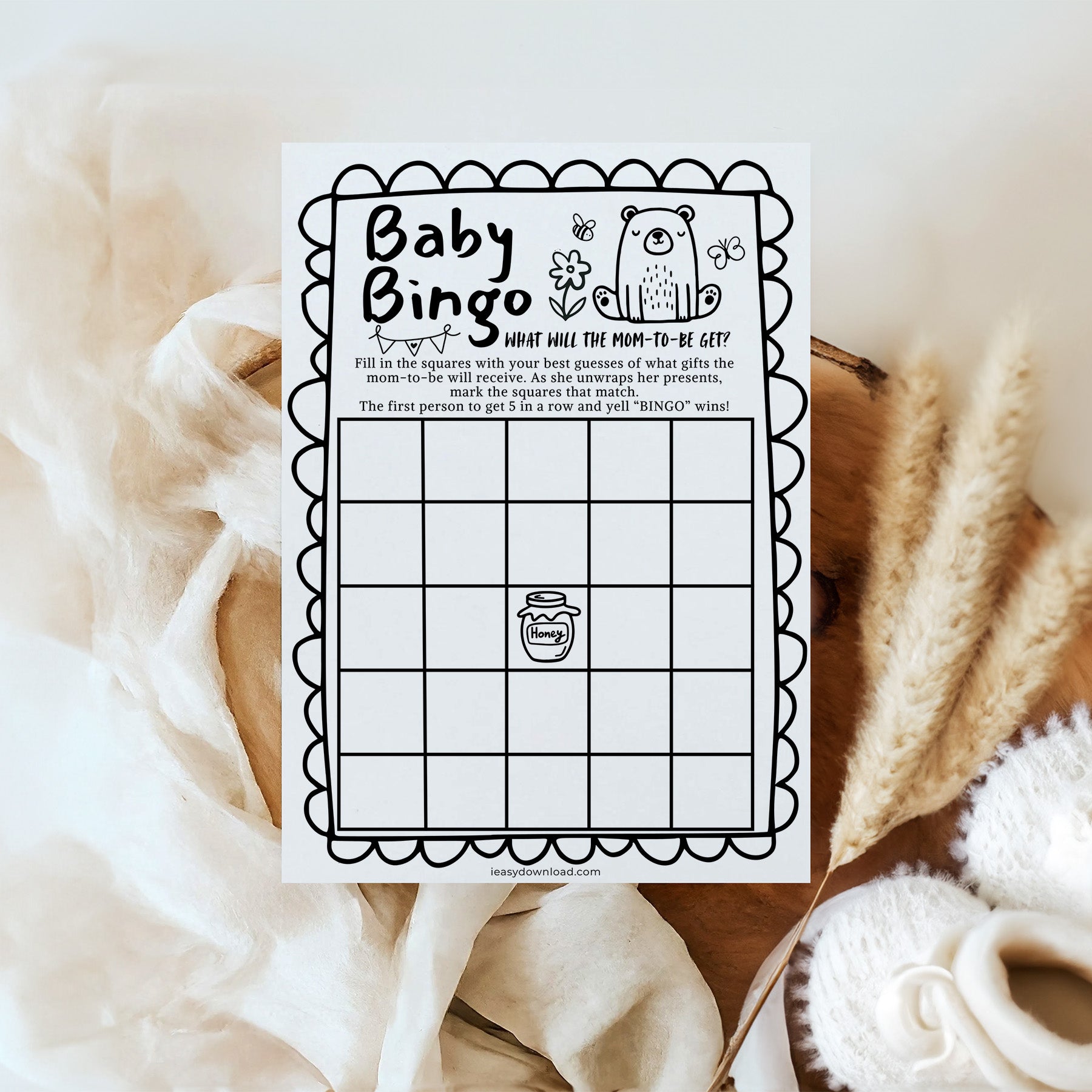 Baby Bingo game card on a soft fabric background