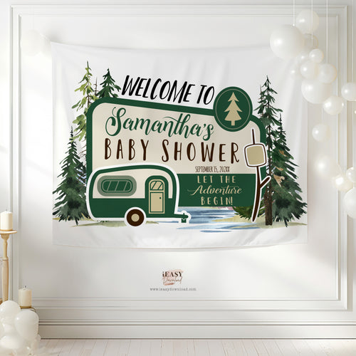Baby shower banner with camper design and text on a white wall.