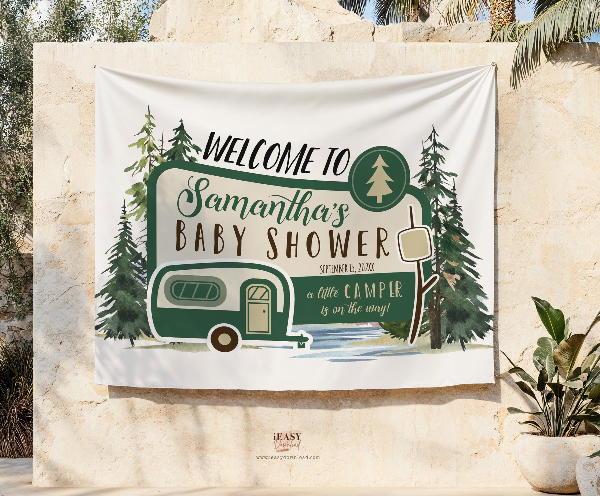 Baby shower welcome sign with camper design on a stone wall