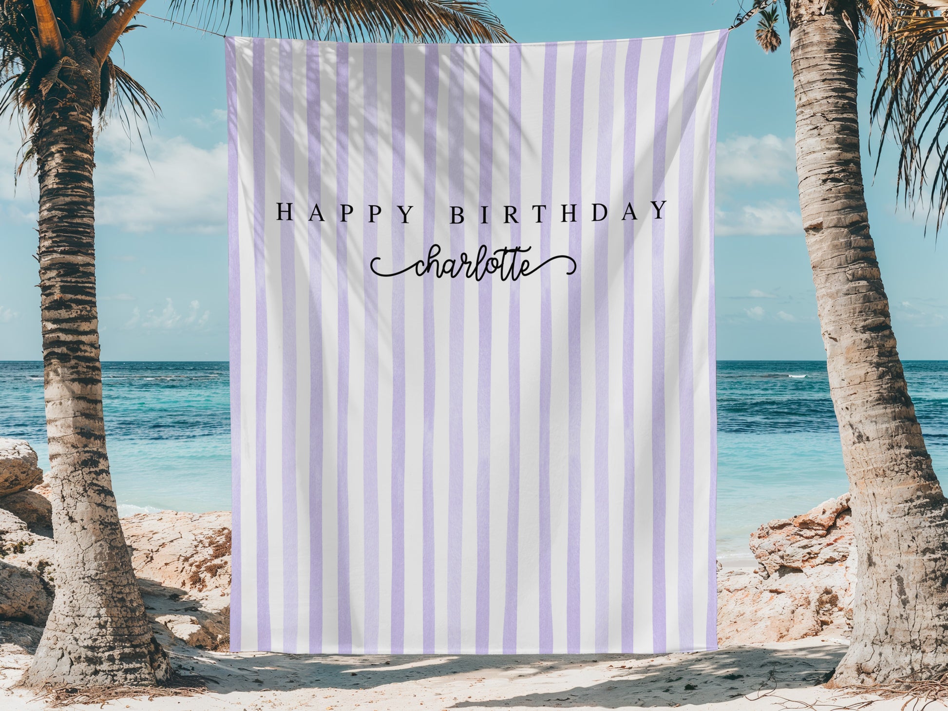 Striped banner with 'Happy Birthday Charlotte' on a beach setting