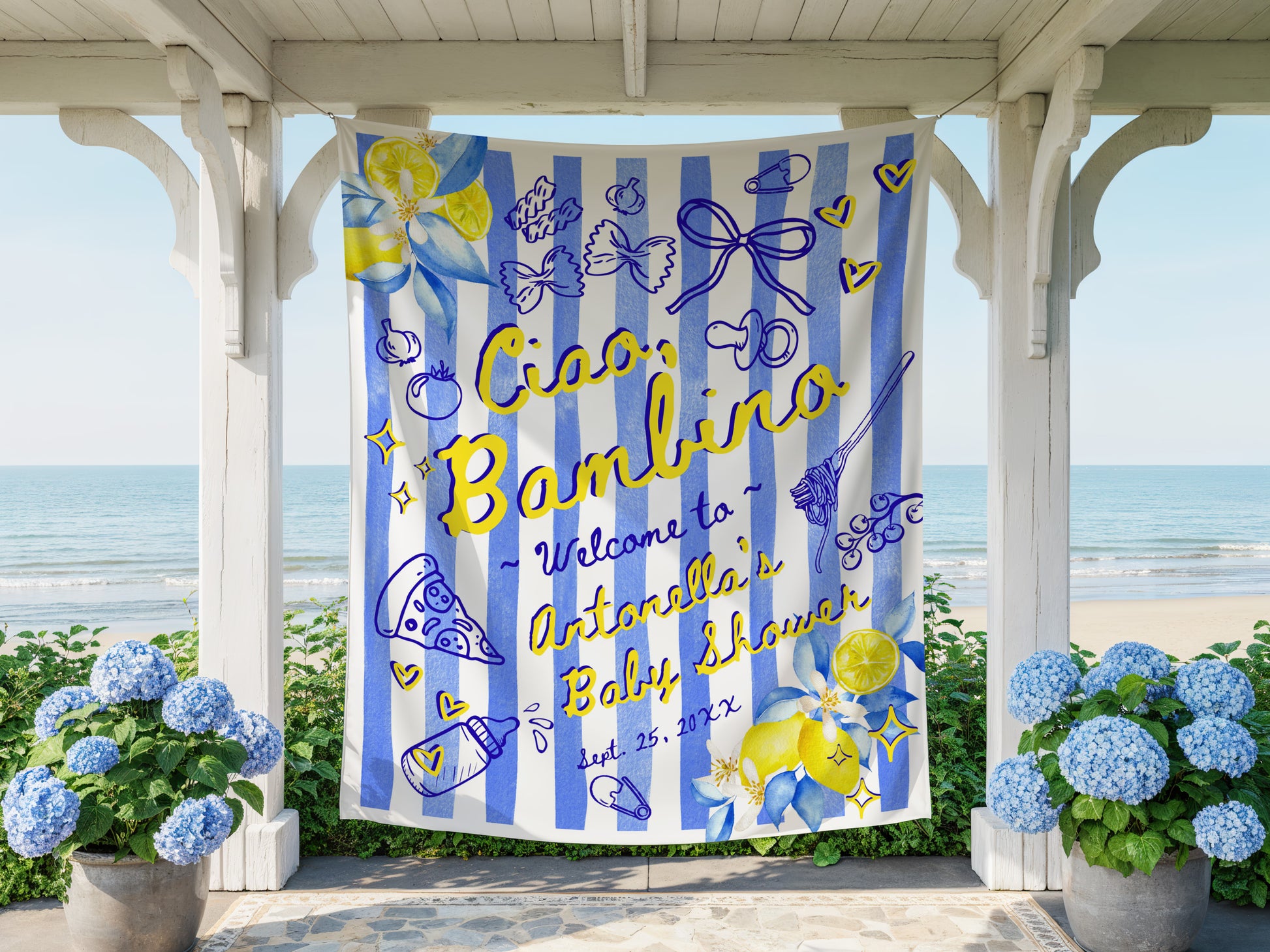 Decorative baby shower banner with blue and yellow design, text 'Ciao Bambino Welcome to Antonella's Baby Shower' on a striped background, displayed outdoors.